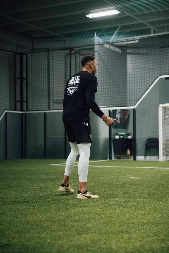 Young players sprinting through agility drills on the indoor turf at Prestige Indoor Sports
