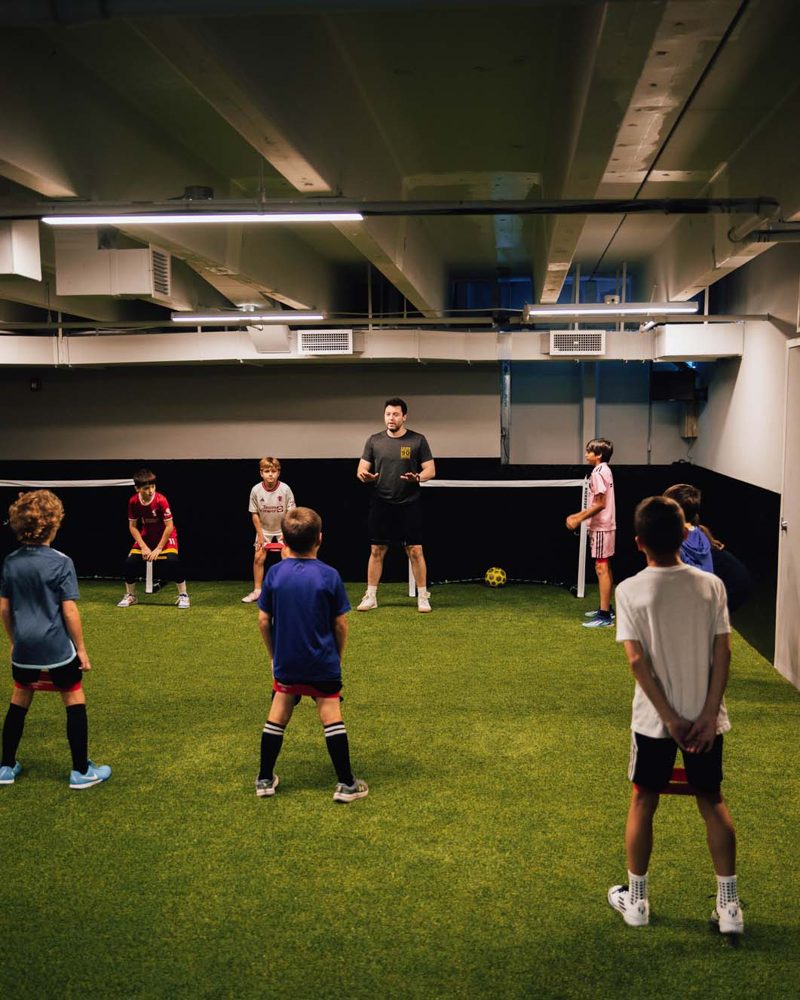 Kids playing small-sided games on the indoor pitch at Prestige Indoor Sports